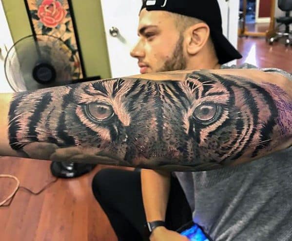 Tiger eye tattoo on forearm