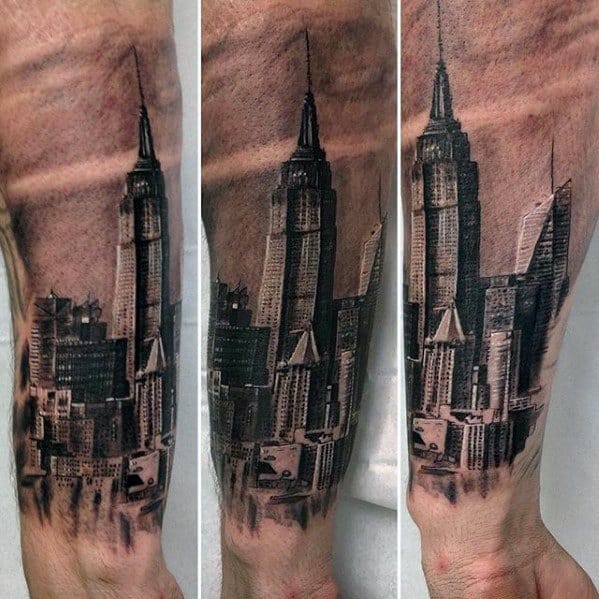 Hyper-realistic forearm tattoo of New York City's skyscrapers, with detailed shading of the Empire State Building and cityscape.