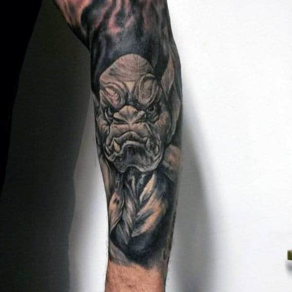 Forearm Sleeve Tattoo Of Gargoyle On Man