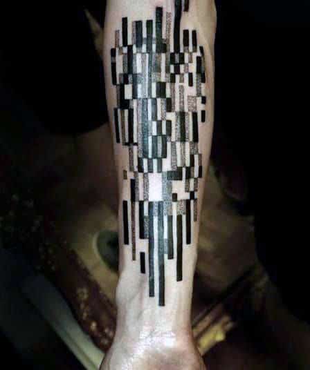 Forearm tattoo with abstract geometric black rectangles and lines