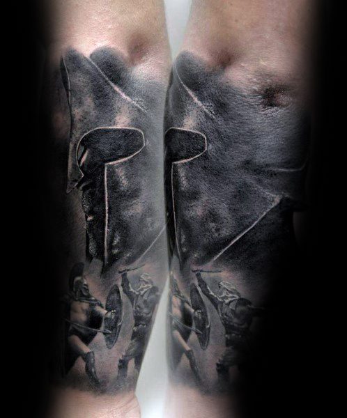 Spartan warrior tattoo with a detailed helmet profile and battle scene, symbolizing bravery, honor, and ancient strength.