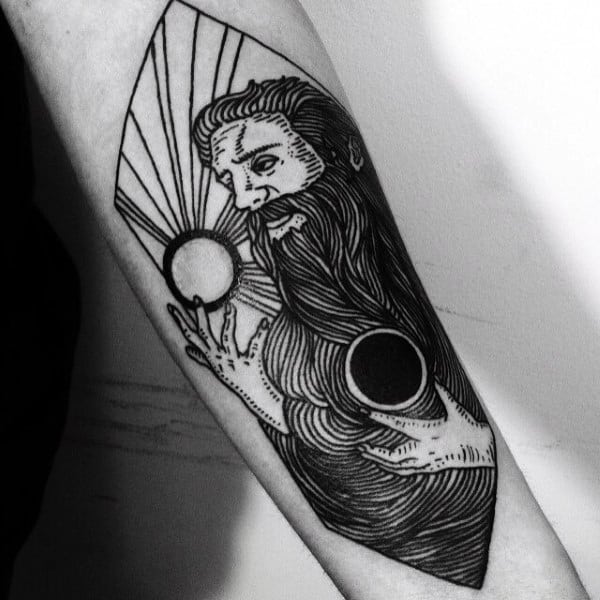 Tattoo of a bearded figure holding celestial bodies with radiating lines on a forearm