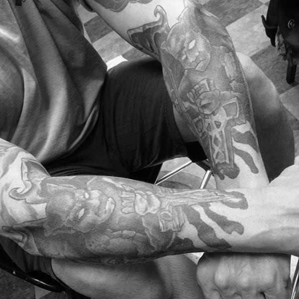 Forearm Tattoos Of Gargoyles On Man