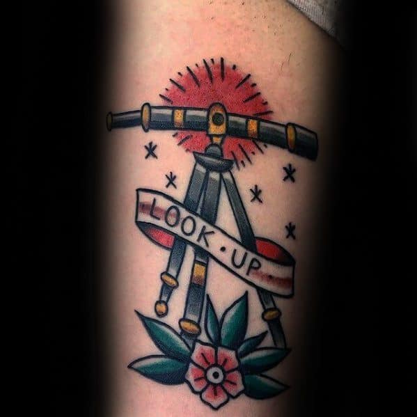 Tattoo: Telescope with "Look Up" banner, stars, and floral accents