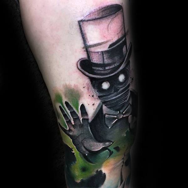 Magician tattoo featuring a ghostly figure in a top hat and bow tie with glowing eyes, symbolizing mystery and magic