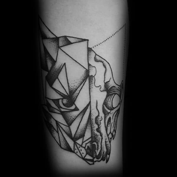 Split fox tattoo with one half in geometric shapes and the other as a skull, detailed with fine dotwork shading.
