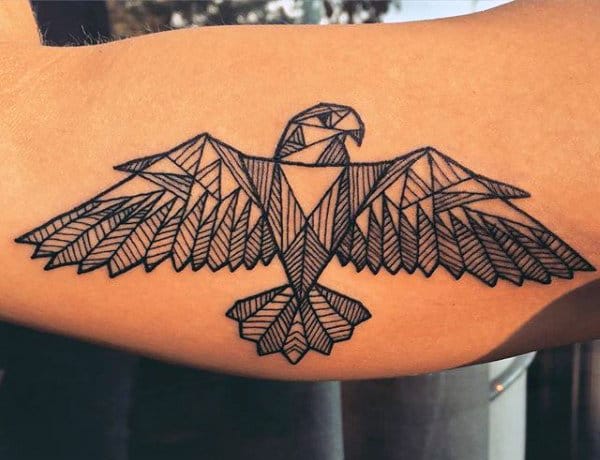Geometric eagle tattoo on inner bicep
