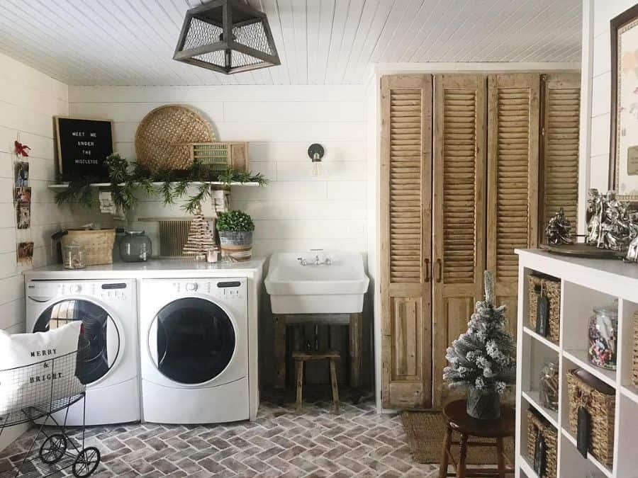 rustic style laundry with free standing sink tile floor