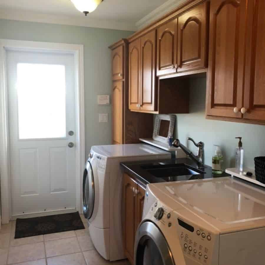 shiplap wall laundry room with free standing sink