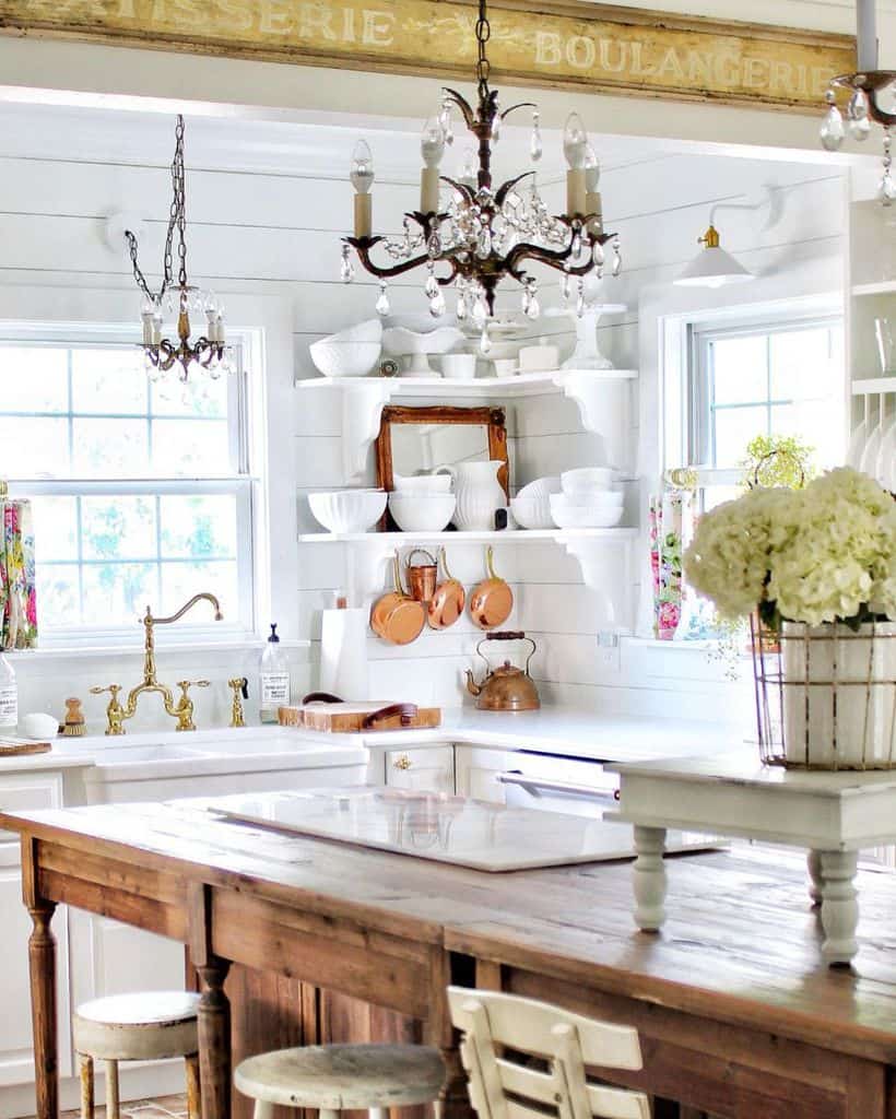 farmhouse kitchen copper pans shelves with cutlery apron sink chandelier