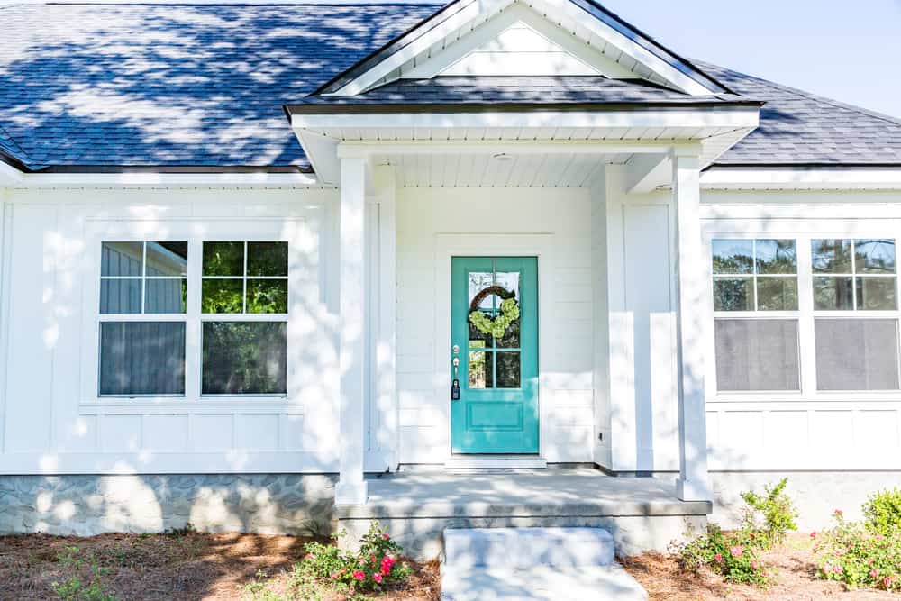 turquoise front door white exterior home