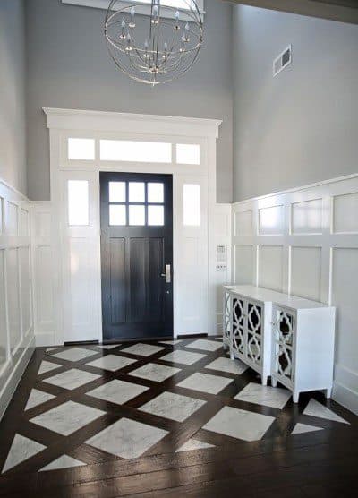 white wainscoting foyer black door