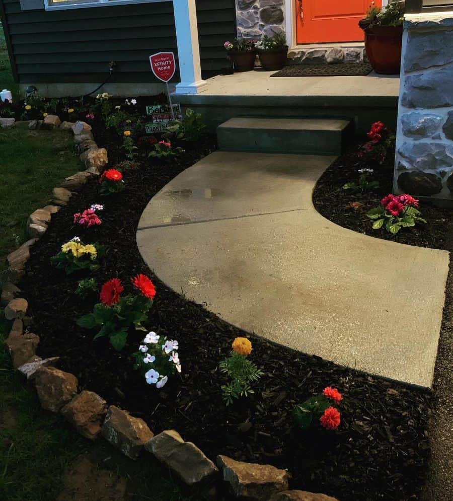 front yard flower bed concrete path front porch