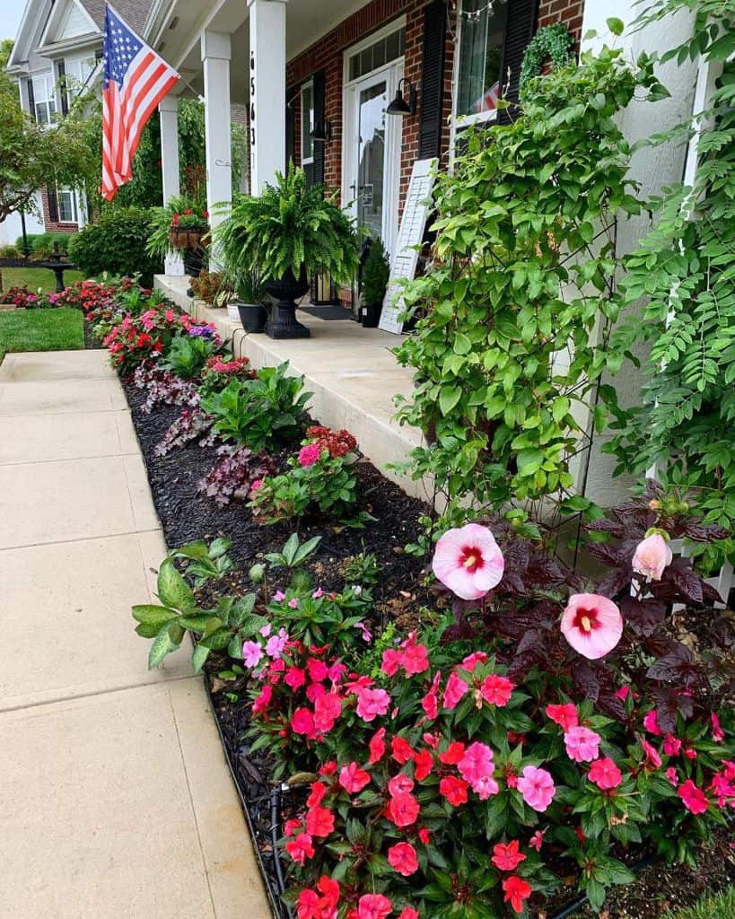 small front yard flower bed american flag