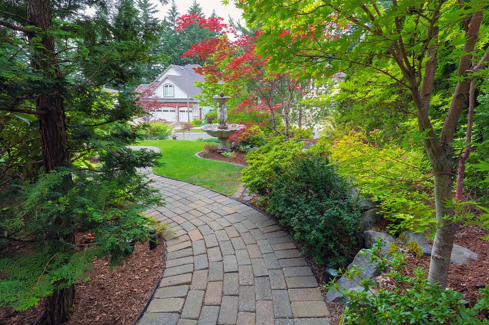 frontyard shade garden with paver pathway