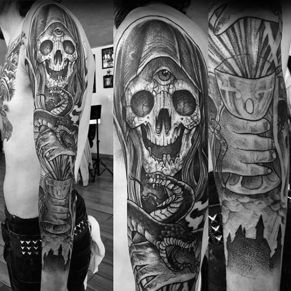 Black and white magician-themed tattoo featuring a hooded skull with a third eye, entwined with a snake, and a mysterious hand holding a magical chalice