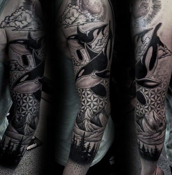 Detailed black and gray orca tattoo sleeve, featuring various elements such as mountains, clouds, geometric patterns, and trees, creating a dynamic and nature-inspired scene.