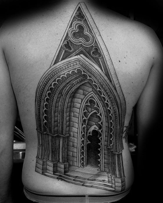 Back tattoo of a gothic cathedral doorway with pointed arches, intricate stonework, and 3D depth for a dramatic architectural effect.