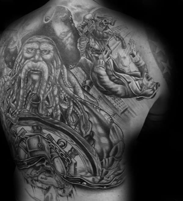 Black and white tattoo of Davy Jones with pirate and sailor scenes on a person's back