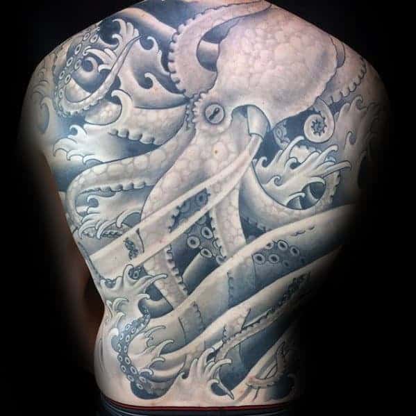 Traditional Japanese full-back tattoo featuring a detailed octopus with flowing tentacles surrounded by ocean waves