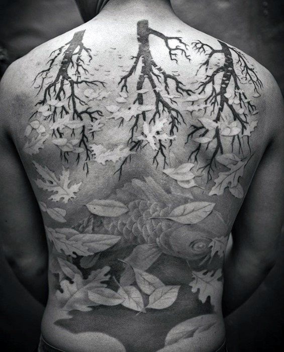 MC Escher-inspired back tattoo blending tree branches into falling leaves that morph into a koi fish swimming beneath the surface.