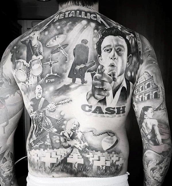 Full back tattoo blending Metallica elements like the logo, Master of Puppets graves, band members performing, and a striking portrait of Johnny Cash.