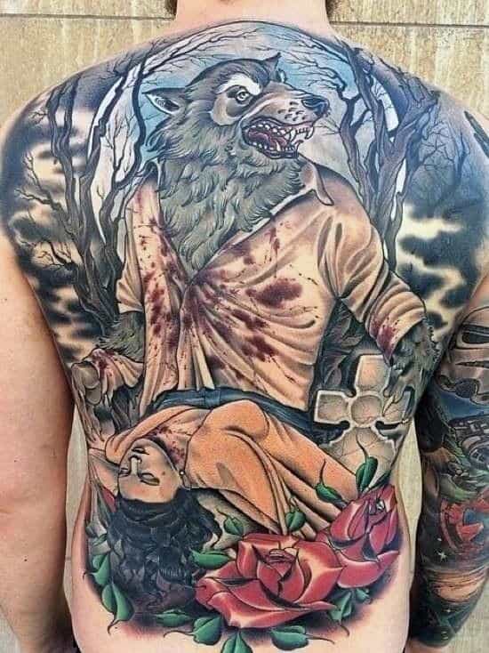 Back tattoo of a werewolf holding a woman, surrounded by trees and roses