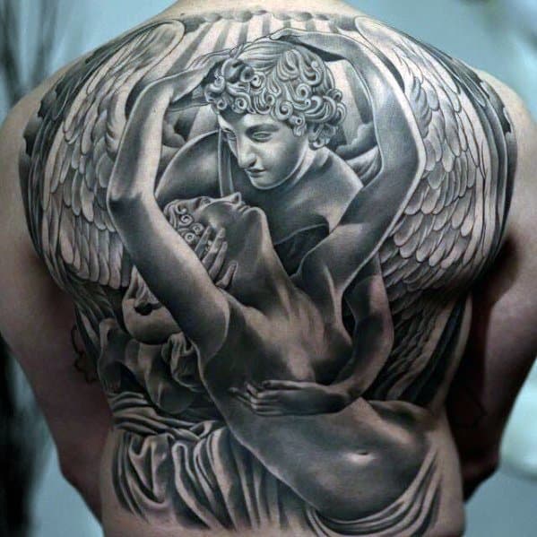 A large, detailed black and grey tattoo on the back, depicting two angels in an intimate embrace with large, intricate wings.
