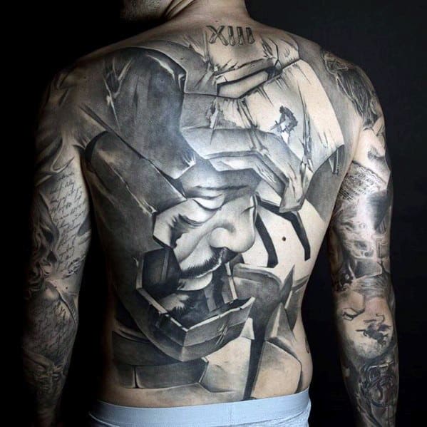 Iron Man tattoo in black and gray, showing Tony Stark’s face within his armor, with intricate details of the helmet opening across the back.