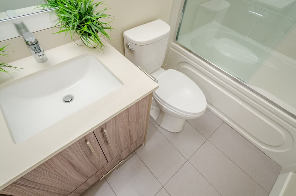 tiny bathroom with shower/bath combo