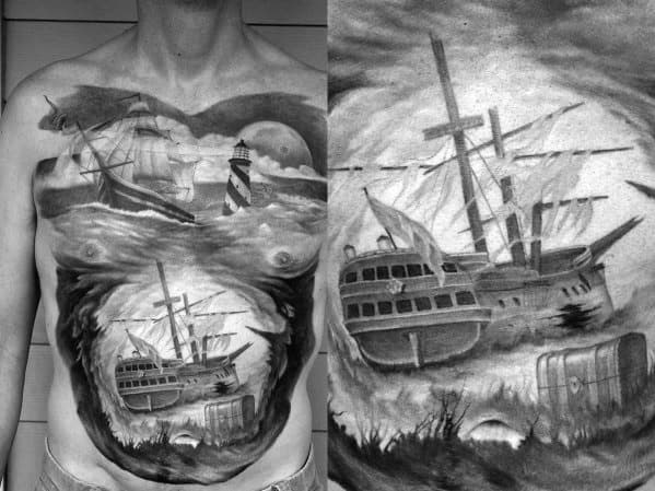 Monochrome chest and torso tattoo of a shipwreck in a swirling ocean, with a lighthouse, full moon, and stormy skies in the background.
