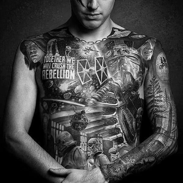 Man with detailed Death Star and Star Wars-themed tattoos on chest and arm