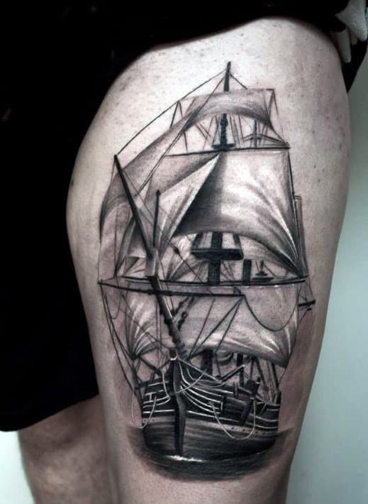 Realistic tattoo of a detailed sailing ship on an upper leg