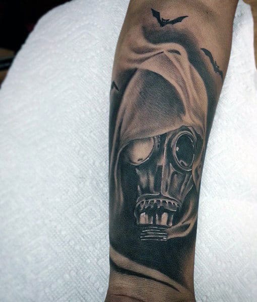 Fuming Male Gas Mask Tattoo On Forearm