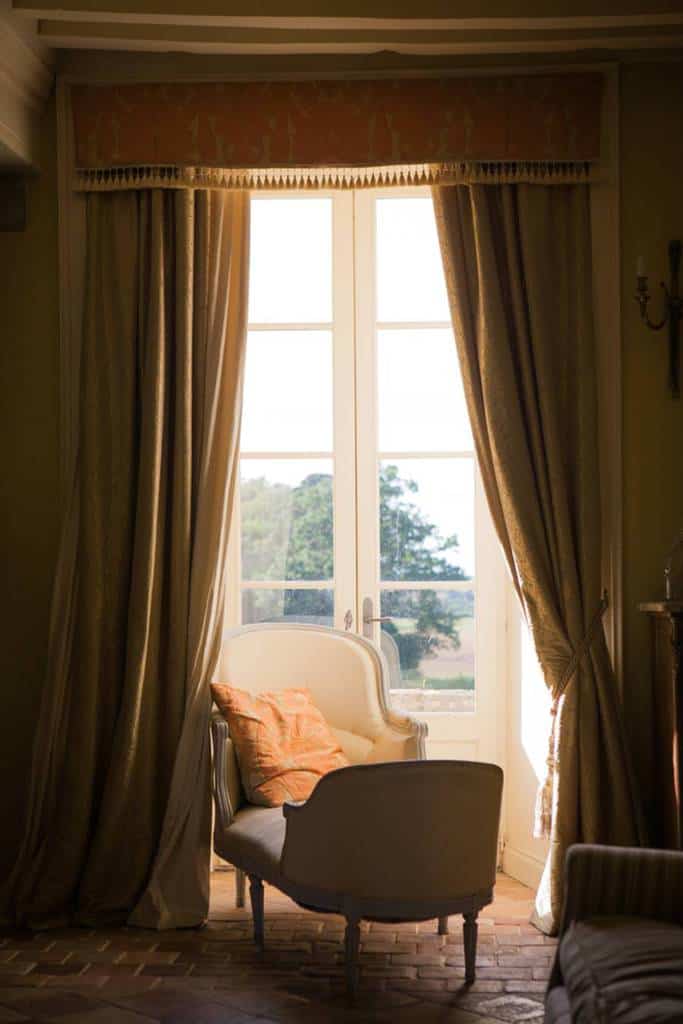 dark room vintage sofa open thick curtains 