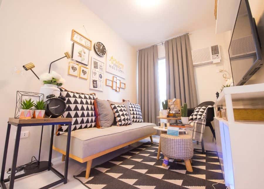 small apartment living room with gray sofa