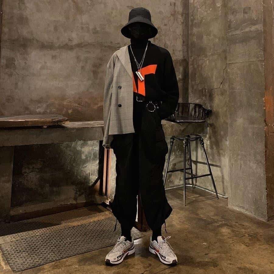 futuristic fashion for men all black outfit with brown cardigan