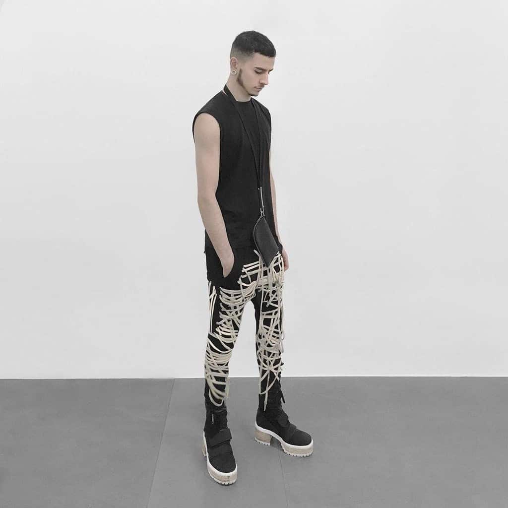 futuristic fashion for men tank top unique pants and wooden sole boots