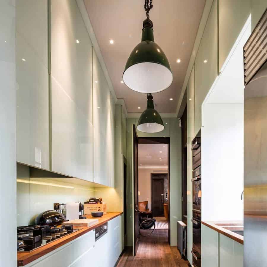pendant lighting in green galley kitchen