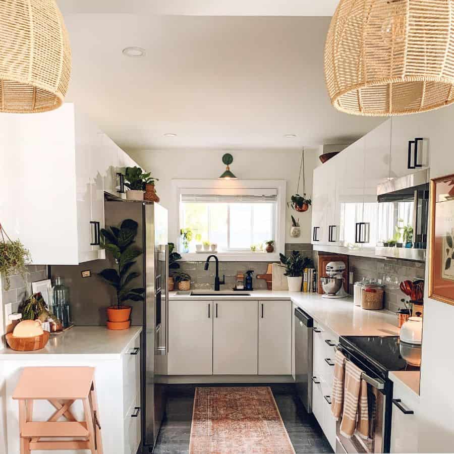 modern kitchen white cabinets with black handles small green light