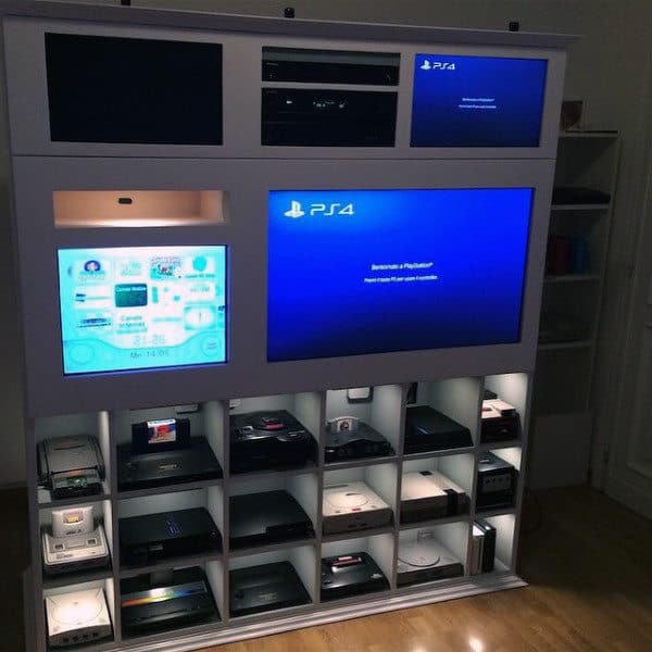 Entertainment center with various gaming consoles and screens, including a PS4 display