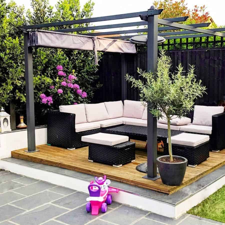 black metal garden gazebo wicker lounge and table retractable roof