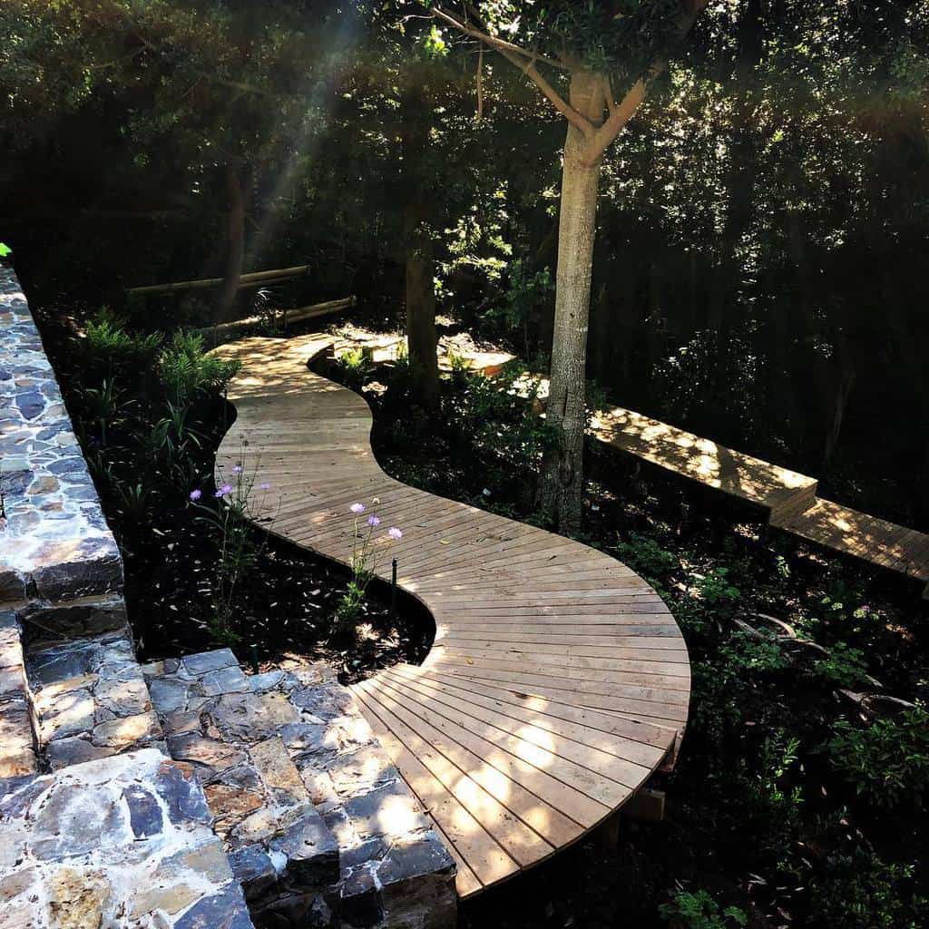 wood walkway in large shade garden