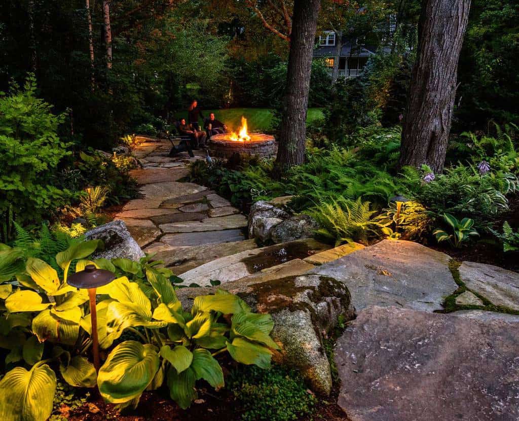 garden path with stone steps leading to fire pit 