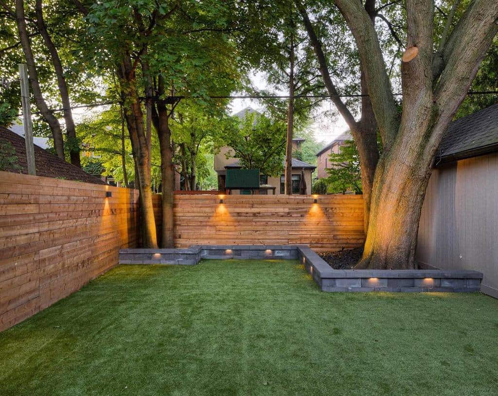 astroturf lawn garden with wood privacy fence