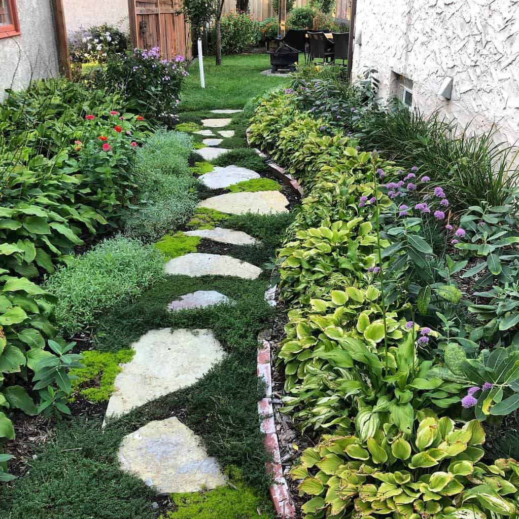 stone garden path in narrow backyard