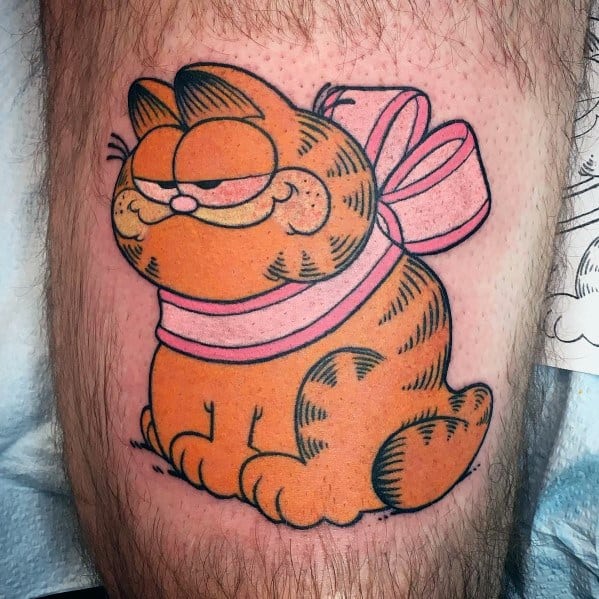 Classic Garfield tattoo with a smug expression, wrapped in a pink bow—combining humor and charm for a playful design.
