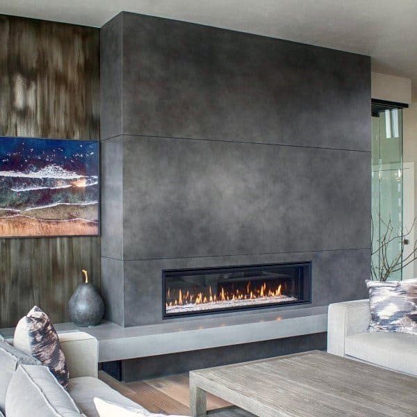 Modern living area with a sleek gas concrete fireplace.