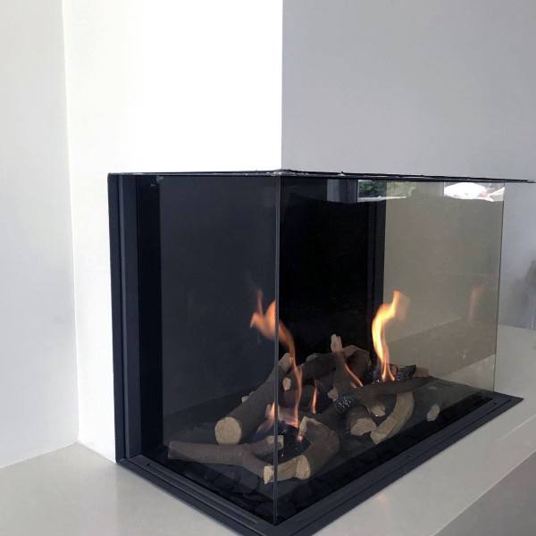 Glass-enclosed corner gas fireplace with realistic log arrangement.