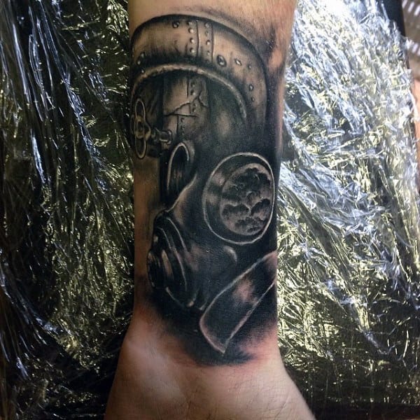 Gas Mask And Pipe Tattoo On Mens Wrist